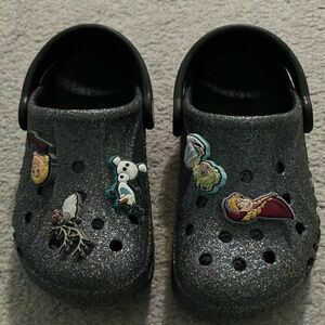 CROCS toddler size 11 Black  with Frozen Jibbitz. Worn only a few times.
